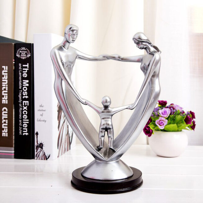 A Family Of Three Resin Ornaments And Crafts